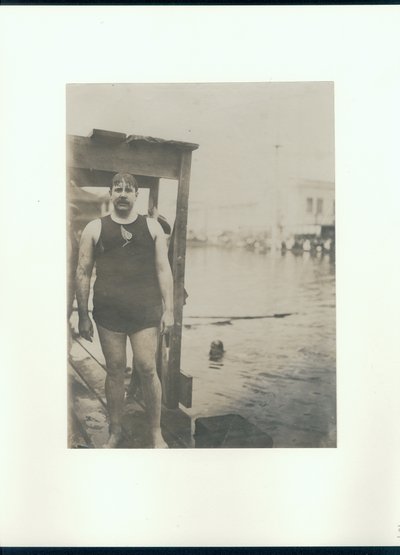 Wet Man in a Swimsuit on a Dock Beside a Lake by Unknown